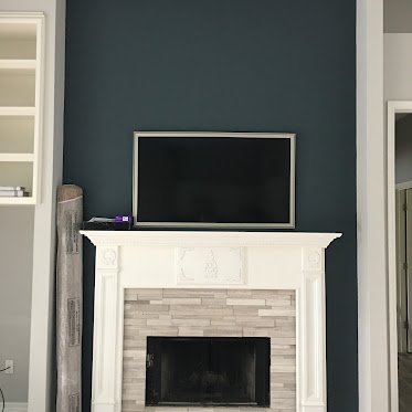 TV mounting above fireplace by Friendly Local Pros